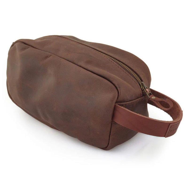 The Dopp Kit is a timeless classic leather toiletry bag. Travel and keep your toiletries protected and organized in style.