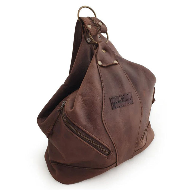 With a slightly bohemian allure, The Evelyn Bag easily adapts from shoulder bag to backpack with one quick zip!