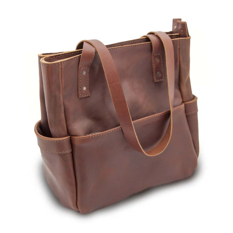 The Penelope will become your everyday handbag. Made from beautiful premium full grain leather and antique brass YKK zippers and hardware.  