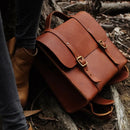 This classic design is simply one of our favorites. Hand crafted in our leather and canvas workshop with 3.5mm thick vegetable tanned leather and antique brass hardware.