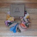Handmade with care, our scrunchies offer a secure hold without pulling or tangling. Each measures around 20mm high and 100mm wide, with slight variations due to our unique, no-waste fabrics.
Soft elastic inside ensures comfort whether worn in your hair or on your wrist. Sustainable, stylish, and one of a kind—just like you