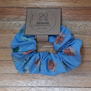 Handmade with care, our scrunchies offer a secure hold without pulling or tangling. Each measures around 20mm high and 100mm wide, with slight variations due to our unique, no-waste fabrics.
Soft elastic inside ensures comfort whether worn in your hair or on your wrist. Sustainable, stylish, and one of a kind—just like you