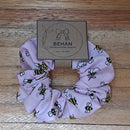 Handmade with care, our scrunchies offer a secure hold without pulling or tangling. Each measures around 20mm high and 100mm wide, with slight variations due to our unique, no-waste fabrics.
Soft elastic inside ensures comfort whether worn in your hair or on your wrist. Sustainable, stylish, and one of a kind—just like you