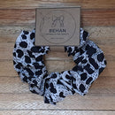 Handmade with care, our scrunchies offer a secure hold without pulling or tangling. Each measures around 20mm high and 100mm wide, with slight variations due to our unique, no-waste fabrics.
Soft elastic inside ensures comfort whether worn in your hair or on your wrist. Sustainable, stylish, and one of a kind—just like you