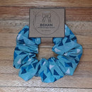 Handmade with care, our scrunchies offer a secure hold without pulling or tangling. Each measures around 20mm high and 100mm wide, with slight variations due to our unique, no-waste fabrics.
Soft elastic inside ensures comfort whether worn in your hair or on your wrist. Sustainable, stylish, and one of a kind—just like you