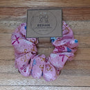 Handmade with care, our scrunchies offer a secure hold without pulling or tangling. Each measures around 20mm high and 100mm wide, with slight variations due to our unique, no-waste fabrics.
Soft elastic inside ensures comfort whether worn in your hair or on your wrist. Sustainable, stylish, and one of a kind—just like you