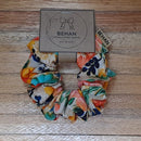 Handmade with care, our scrunchies offer a secure hold without pulling or tangling. Each measures around 20mm high and 100mm wide, with slight variations due to our unique, no-waste fabrics.
Soft elastic inside ensures comfort whether worn in your hair or on your wrist. Sustainable, stylish, and one of a kind—just like you