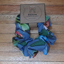 Handmade with care, our scrunchies offer a secure hold without pulling or tangling. Each measures around 20mm high and 100mm wide, with slight variations due to our unique, no-waste fabrics.
Soft elastic inside ensures comfort whether worn in your hair or on your wrist. Sustainable, stylish, and one of a kind—just like you