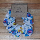 Handmade with care, our scrunchies offer a secure hold without pulling or tangling. Each measures around 20mm high and 100mm wide, with slight variations due to our unique, no-waste fabrics.
Soft elastic inside ensures comfort whether worn in your hair or on your wrist. Sustainable, stylish, and one of a kind—just like you