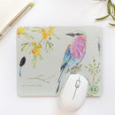Experience the seamless blend of functionality and artistry with the Indigo Birds, Fynbos and Lilac-breasted Roller Mousepad, featuring birds in flight painted with indigo watercolour.