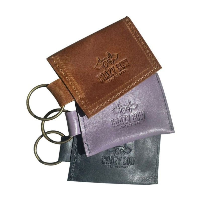 Small, but packs a big punch!

Card and coin leather keychain pouch.

9cm x 6cm with a 2.5cm ring
Made from full grain bovine leather
Small brass press stud and brass ring
Available in black, denim diesel, lilac & toffee. Other leather colours available on request.