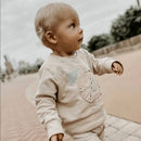 The Most comfortable and soft tracksuit out. The sweater has Bear face detail and the Harem style joggers has Knee Fur Detail.
This Tracksuit comes with a matching Knitted rolled hem beanie in the most stunning "feels like cashmere" wool.
100% Cotton Brushed Fleece and Ribbing
Available in 3 colors: Stone, Grey Melange and Dusty Pink
