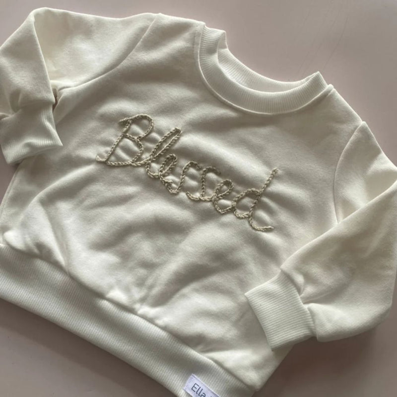 WE ARE BLESSED!!

Our Comfortable Sweaters made out of Cotton Brushed Fleece for the windy or cooler weather.

(Warm Fleece Cuddly feel on the inside of our Fabric).

Colour - Cream & Stone Hand Embroidery Detail