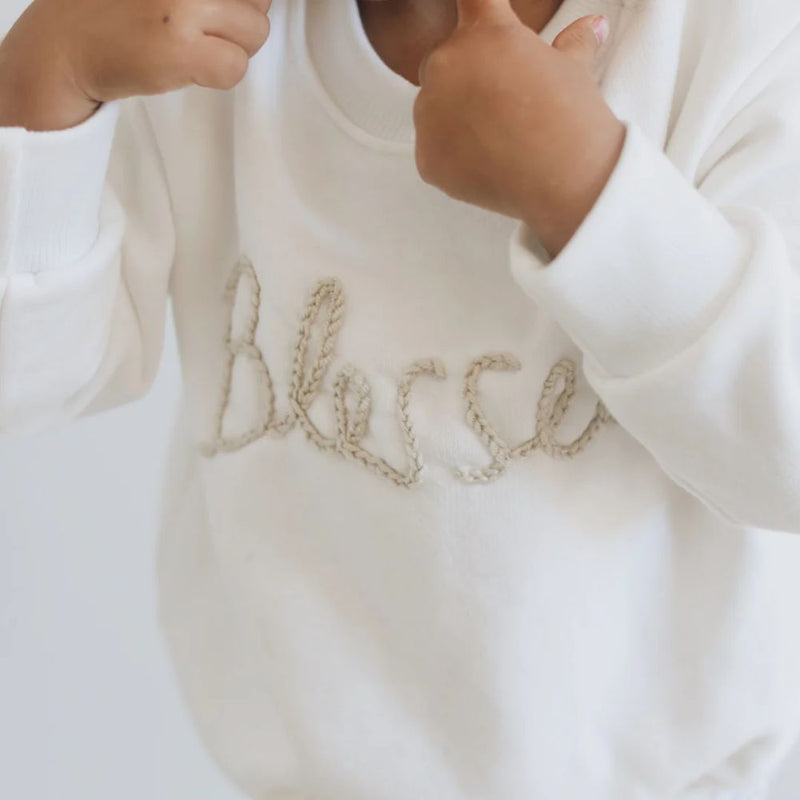 WE ARE BLESSED!!

Our Comfortable Sweaters made out of Cotton Brushed Fleece for the windy or cooler weather.

(Warm Fleece Cuddly feel on the inside of our Fabric).

Colour - Cream & Stone Hand Embroidery Detail