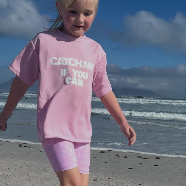 Playful, energetic, and full of charm! Our Catch Me Set features a comfy pair of floral bicycle print tights and a matching top with the bold slogan “Catch me if you can.”
