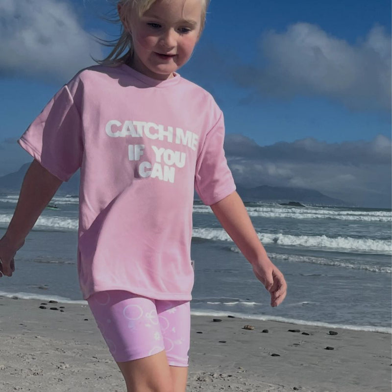 Playful, energetic, and full of charm! Our Catch Me Set features a comfy pair of floral bicycle print tights and a matching top with the bold slogan “Catch me if you can.”