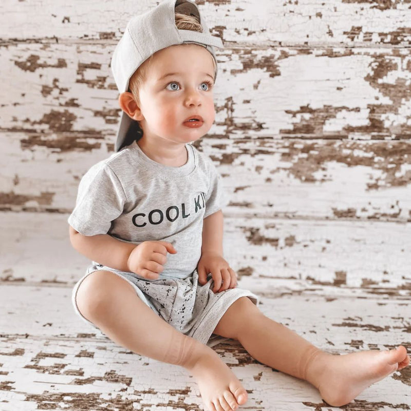 Cool, light and perfect for spring, summer and play time!

Made in 100% Cotton fabric.

Single printed cool kid T-shirt | Unbrushed Fleece Shorts with splatter ink print and string detail. 

