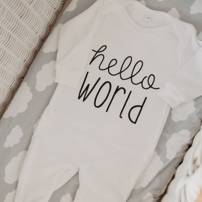 Hello World Romper designed by the Blessed Baby Collection

Press studs - Crotch area for easy opening and closing. 

White Cotton Interlock 100% Cotton Fabric 