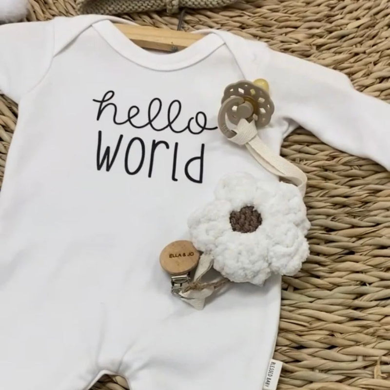 Hello World Romper designed by the Blessed Baby Collection

Press studs - Crotch area for easy opening and closing. 

White Cotton Interlock 100% Cotton Fabric 