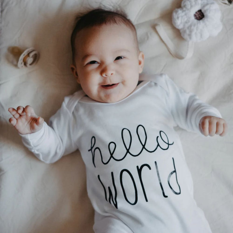 Hello World Romper designed by the Blessed Baby Collection

Press studs - Crotch area for easy opening and closing. 

White Cotton Interlock 100% Cotton Fabric 