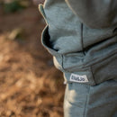 The Khaki Bear Tracksuit is not just an ordinary one. It has been designed with comfort, style and play time in mind. Front pocket has bear face detail, and the legs has soft cushion openings which provides extra cushioning when little one is crawling or sitting.

Colour - Khaki Melange