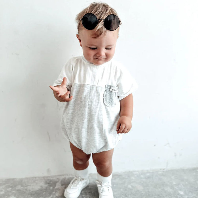 Our Oversized two-toned Knox romper is the stylish romper for boys.

It has Snap clips at crotch for easy nappy changing.

Made in Beautiful 100% Cotton Lightweight fabric. 

Rib Pocket detail for a trendy look.