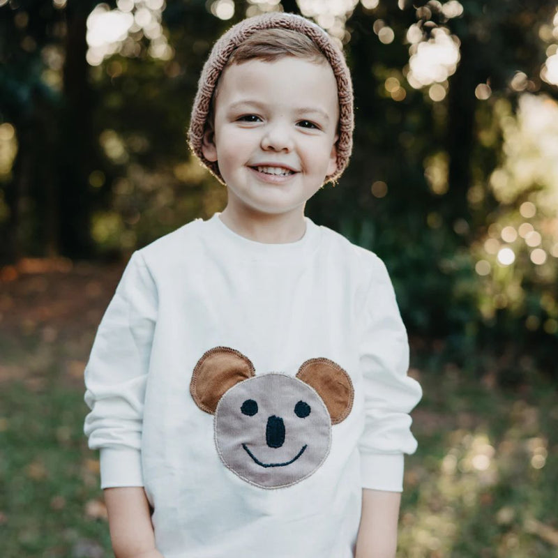 Our Comfortable Sweaters made out of 100% Cotton Brushed Fleece for the windy or cooler weather.

Artwork - Koala

Colour -Winter White