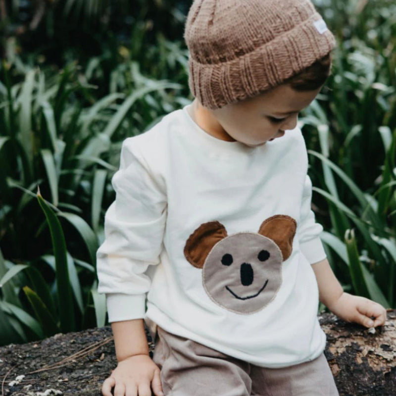 Our Comfortable Sweaters made out of 100% Cotton Brushed Fleece for the windy or cooler weather.

Artwork - Koala

Colour -Winter White