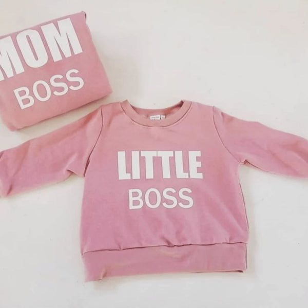 The Mom Boss and Little Boss Crew Neck, the ultimate matching outfit for stylish moms and their little ones. Designed with love and locally handmade, this cozy and comfortable sweater is the essential clothing item for all the mom bosses out there!