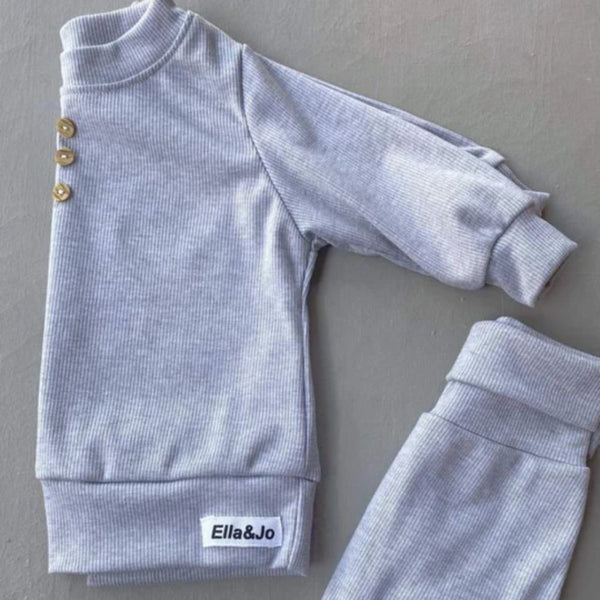 Stay Comfortable and warm in the Ribbed Loungewear set. These pants are not only for lounging around, but they are also perfect for outdoor activities on those cooler days. Harem style joggers with cuff bottoms. Crewneck sweatshirt with button detail.

Colour - Light Grey | Black | Sky Blue 

