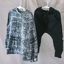 Our Monochrome Smudge Sweater is made up in 100% Cotton ribbing - The perfect winter essential to add to your little Ones's wardrobe for the cooler days.

Black & White