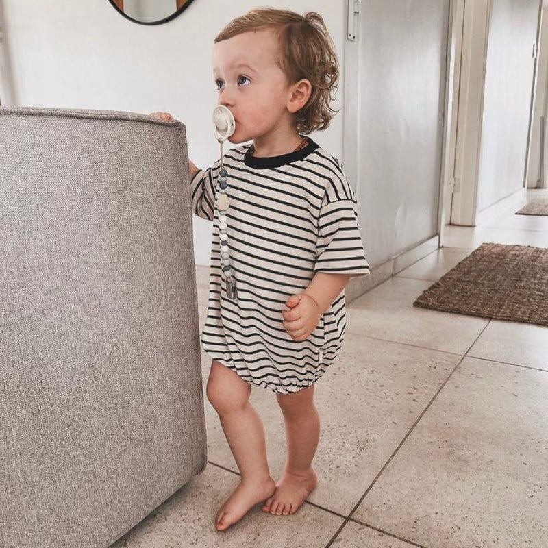 Our Oversized two colour Stripe romper is the stylish romper for boys or girls. 

It has Snap clips at crotch for easy nappy changing.

Made in Beautiful 100% Cotton Lightweight fabric. 
colour - Cream and Black 

 