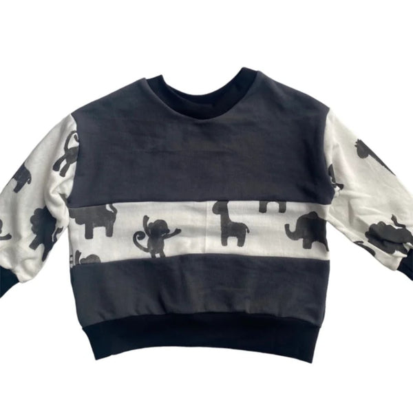 Our Comfortable colour block Sweater is made out of 100% Cotton Brushed Fleece for the windy or cooler weather.

Our wild animals are carefully hand crafted into our 100% cotton fabric and then heat cured to set.

Oversized Fit