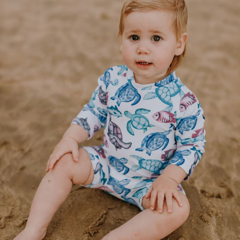 Turtle body suit designed in such a stylish Fun print. 
Full Body Swimsuit Style             
Snug Body fit
Zipper at back
Long sleeves
UPF50+

