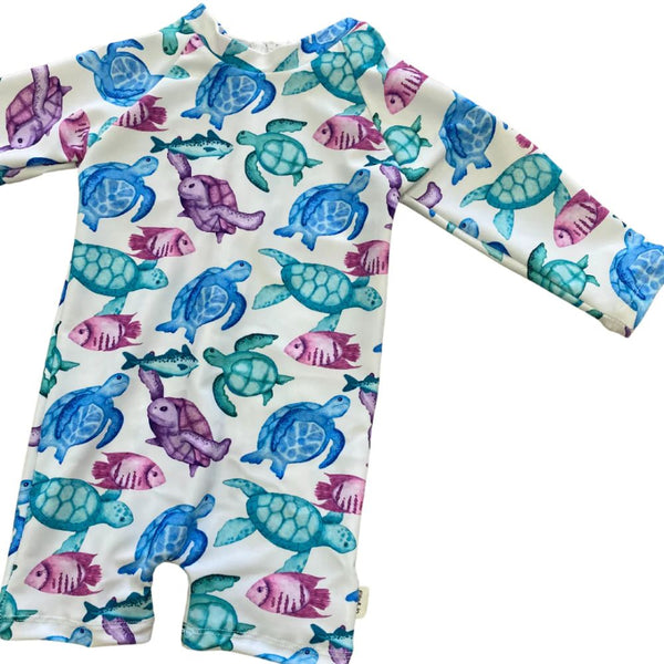 Turtle body suit designed in such a stylish Fun print. 
Full Body Swimsuit Style             
Snug Body fit
Zipper at back
Long sleeves
UPF50+

