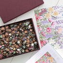 Each puzzle comes in a bespoke, gold-foiled burgundy box, custom-made to close seamlessly and hold lid and base tight together so that you can store your puzzle on display alongside your books on your bookshelf.