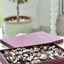 Each puzzle comes in a bespoke, gold-foiled burgundy box, custom-made to close seamlessly and hold lid and base tight together so that you can store your puzzle on display alongside your books on your bookshelf.