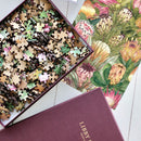 Each puzzle comes in a bespoke, gold-foiled burgundy box, custom-made to close seamlessly and hold lid and base tight together so that you can store your puzzle on display alongside your books on your bookshelf.