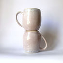 Handcrafted Mugs. Featuring a fading pink design. Ideal for a nice coffee. 