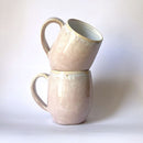 Handcrafted Mugs. Featuring a fading pink design. Ideal for a nice coffee. 