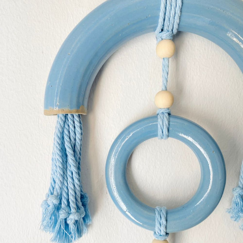 Reverberations are handcrafted wall-hanging art pieces combining textured stoneware and soft fibre elements.