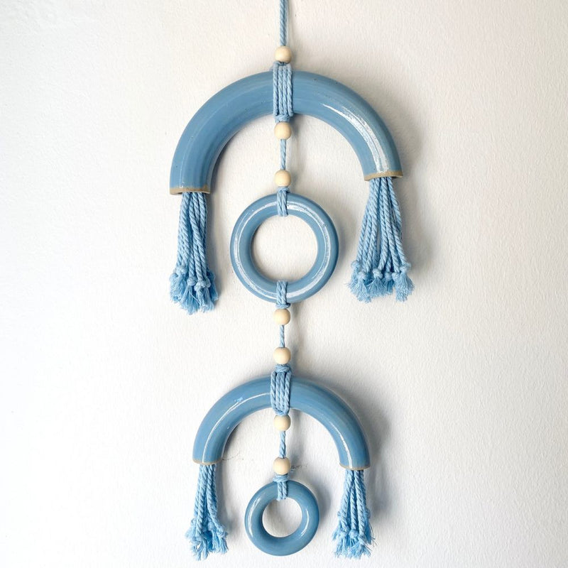 Reverberations are handcrafted wall-hanging art pieces combining textured stoneware and soft fibre elements.
