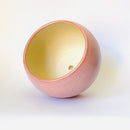 Handmade ceramic flower pot in a soft pink glaze, perfect for showcasing indoor plants or succulents. This artisanal planter adds a touch of warmth and charm to your home décor while providing a stylish and durable home for your greenery.