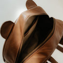 Cuddly, calm, and always ready for snacks — that’s Benny the Bear!
This classic brown leather backpack is perfect for cozy adventures and everyday outings. 