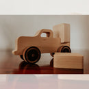 Timber the Block Hauler: Timber's on the job! This wooden block hauler hauls two square blocks, perfect for building and stacking.