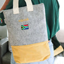 made from locally sourced materials

material:
Recycled PET plastic felt, capri material and a 100% cotton strap
dimensions: 38cm x 30cm