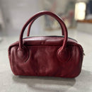 Lighter, softer and with easy handles and a crossbody strap.  Meet the all new MINI POSTCALL.