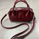 Lighter, softer and with easy handles and a crossbody strap.  Meet the all new MINI POSTCALL.