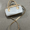 Lighter, softer and with easy handles and a crossbody strap.  Meet the all new MINI POSTCALL.