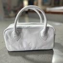 Lighter, softer and with easy handles and a crossbody strap.  Meet the all new MINI POSTCALL.